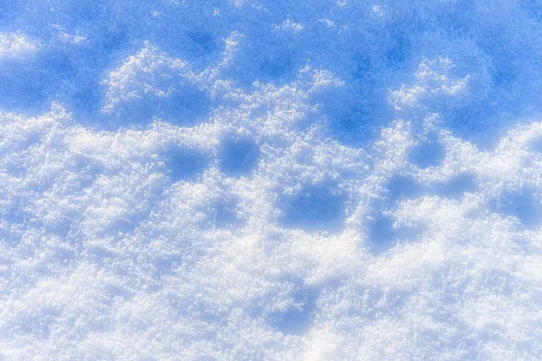 Sneeuwtextuur op zonnige winterdag. Abstracte achtergrond. — Stockfoto