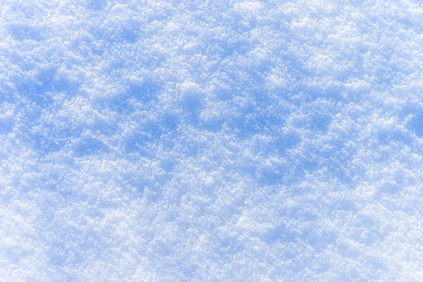 Textura de neve no dia ensolarado de inverno. Contexto abstrato . — Fotografia de Stock