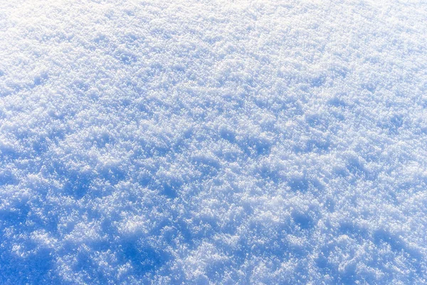 Textura de neve no dia ensolarado de inverno. Contexto abstrato . — Fotografia de Stock