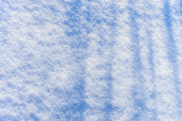 Textura de neve no dia ensolarado de inverno. Contexto abstrato . — Fotografia de Stock