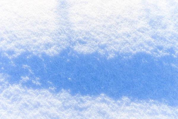 Textura de nieve en el soleado día de invierno. Fondo abstracto . —  Fotos de Stock