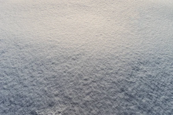 Sneeuwtextuur op zonnige winterdag. Abstracte achtergrond. — Stockfoto