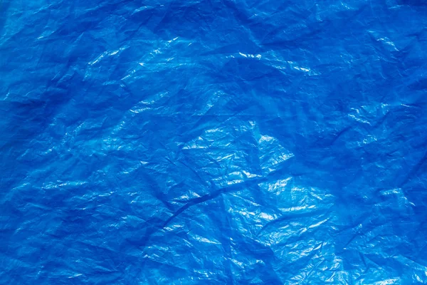 Textur av skrynklig blå plastpåse. Abstrakt bakgrund — Stockfoto