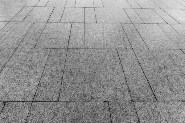 Vista superior sobre pavimento camino de piedra. Antiguo pavimento de textura de granito . — Foto de Stock