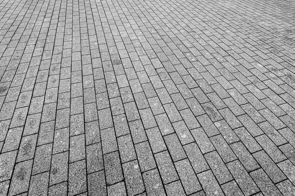 Top view on paving stone road. Old pavement of granite texture. — Stock Photo, Image