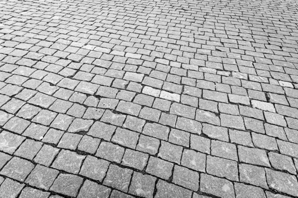 Вид сверху на асфальтированную каменную дорогу. Старый тротуар из гранитной текстуры . — стоковое фото