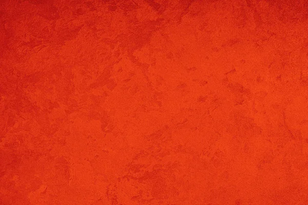 พื้นผิวของพลาสเตอร์ตกแต่งสีแดงหรือคอนกรีต พื้นหลังแบบนามธรรมสําหรับการออกแบบ แบนเนอร์สไตล์ศิลปะที่มีพื้นที่สําเนาสําหรับข้อความ . — ภาพถ่ายสต็อก