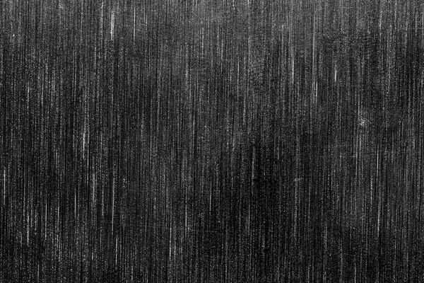 Black metal texture with white scratches. Abstract noise black background overlay for design.