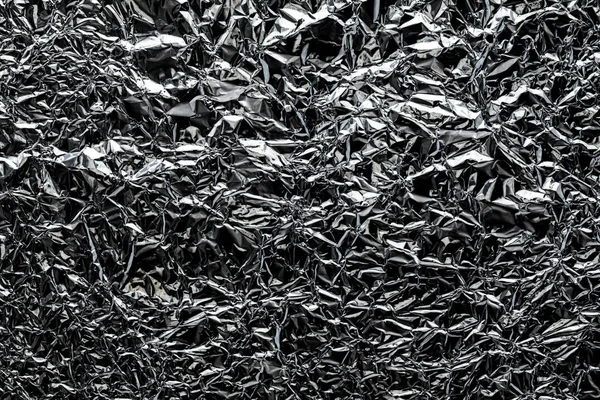 Konsistens av skrynklig aluminium köksfolie. Silverabstrakt backd — Stockfoto