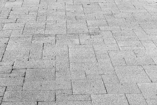 モノクローム舗装石の道路上のトップビュー 花崗岩の質感の古い舗装 街の石畳の歩道 デザインの要約 — ストック写真