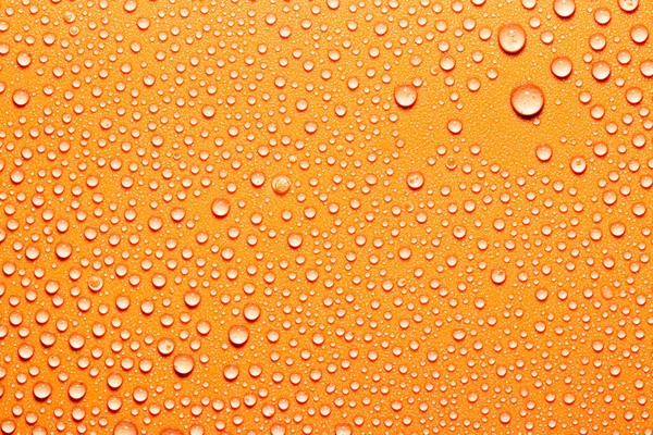 宏观水滴纹理在橙色背景上 设计所需的抽象图案或空白 — 图库照片
