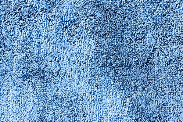 Texture of blue concrete or plastered wall. Abstract background for design with copy space for text.
