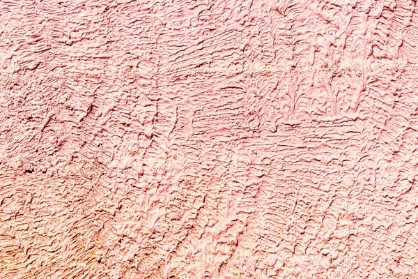 Texture of red concrete or plastered wall. Abstract background for design with copy space for text.