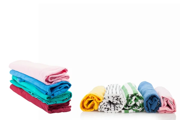 Pile of colorful clothes isolated on white background. — Stock Photo, Image