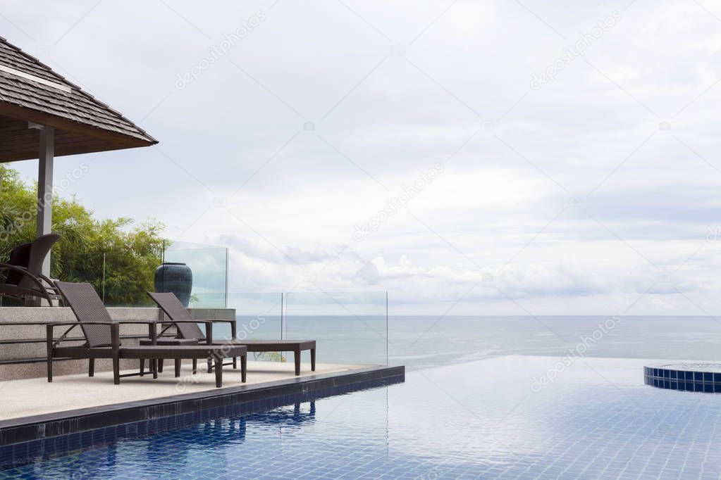 Beach chair in outdoor with swimming pool and sea view andaman s