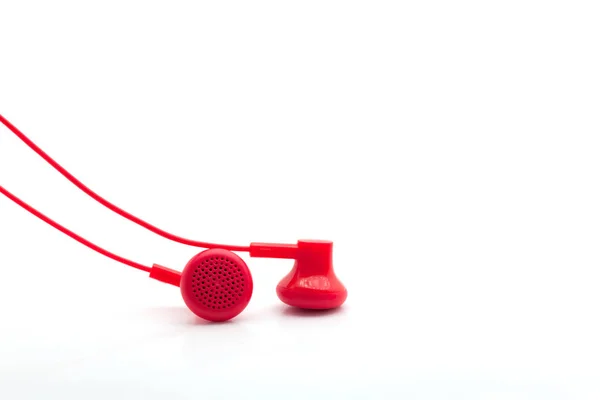 Rode oortelefoon op witte achtergrond. — Stockfoto