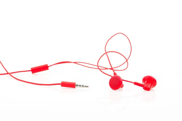 Écouteur rouge isolé sur fond blanc. — Photo