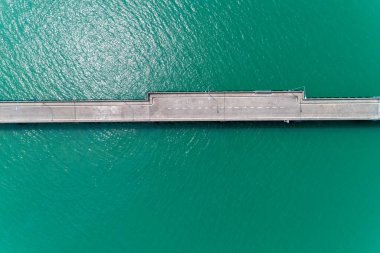 Aerial top view drone shot of small bridge in the sea image tran