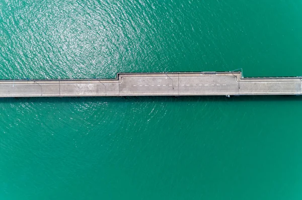 Aerial top view drone shot of small bridge in the sea image tran — Stock Photo, Image