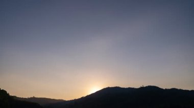4K - timelapse of sky and clouds sunset over mountain in phuket thailand