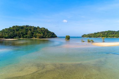 Aerial view drone shot of tropical sea with small island 