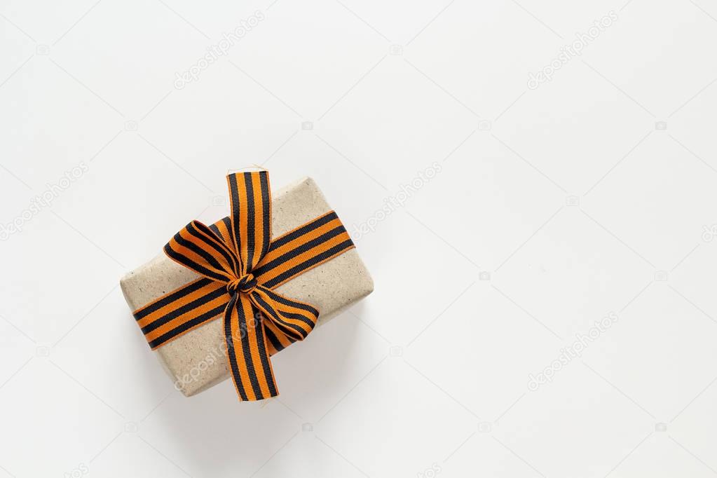 Gift box with st george ribbons on the white background. Defende