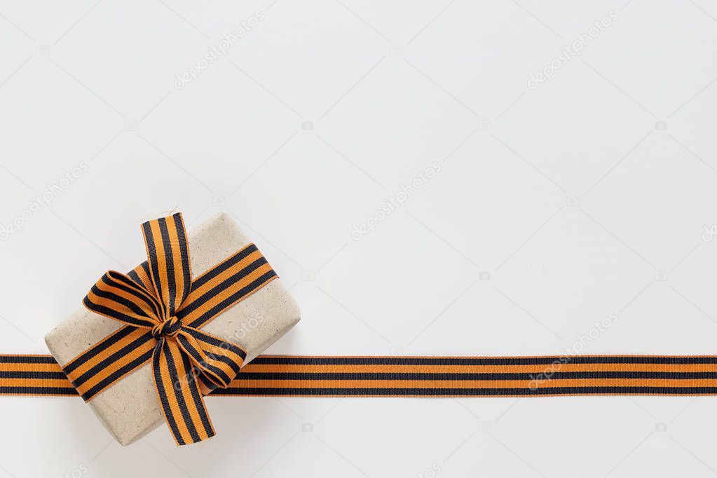 Gift box with st george ribbons on the white background. Defende
