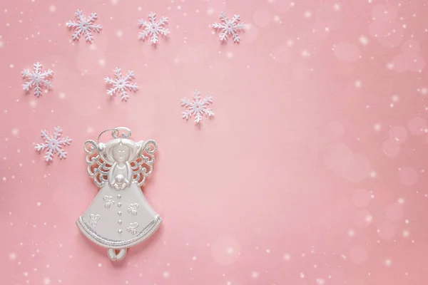 Holiday christmas background with angel on pink. Copy space. — Stock Photo, Image