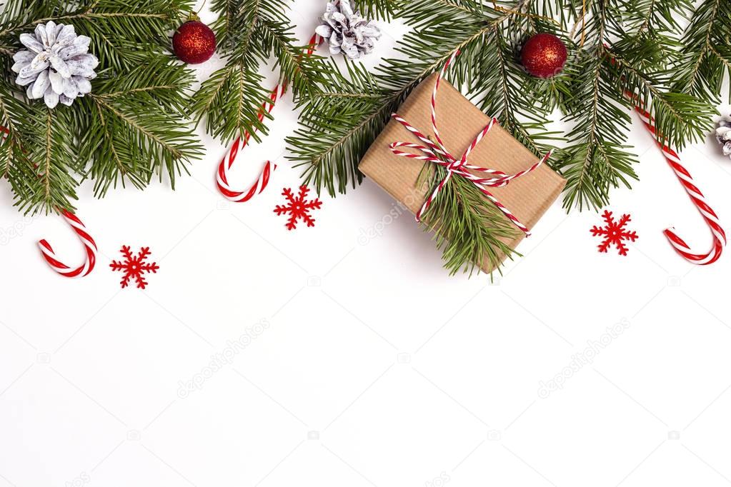 Christmas background with gift box, fir branches and decorations