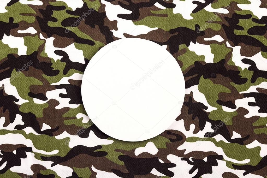 White round frame on military camouflage background. Place for t