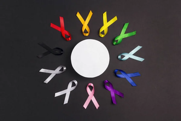 Circle of  colorful awareness ribbons with place for text on bla — 스톡 사진