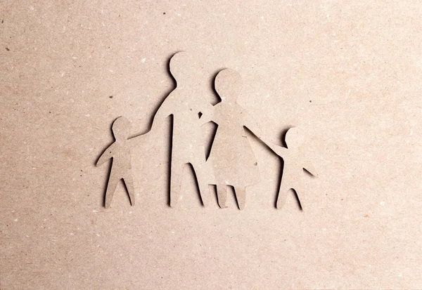 Silhouette famille papier découpé sur carton . — Photo