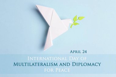 Uluslararası Çok Taraflıcılık Günü ve Barış Diplomasisi, 24 Nisan. Mavi arka planda zeytin dalı ile barış güvercini.. 