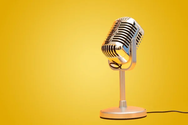 Retro vintage microphone on yellow background studio — Stock Photo, Image