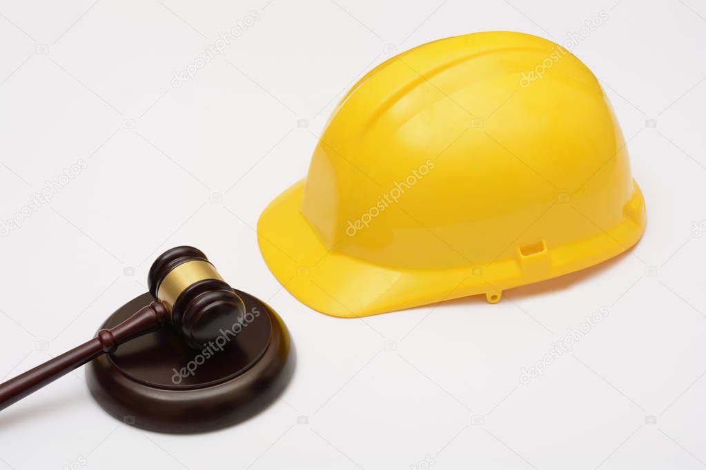 Labor Law with safety helmet and gavel