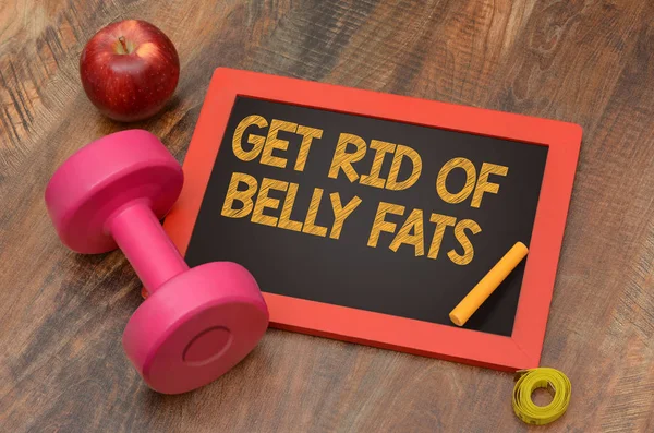 Get rid of Belly fats fitness concept with dumbbell and apple