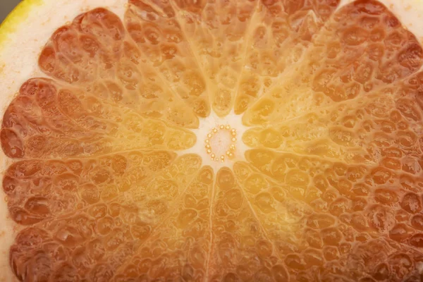 Close up photo of grapefruit on gray background — Stock Photo, Image