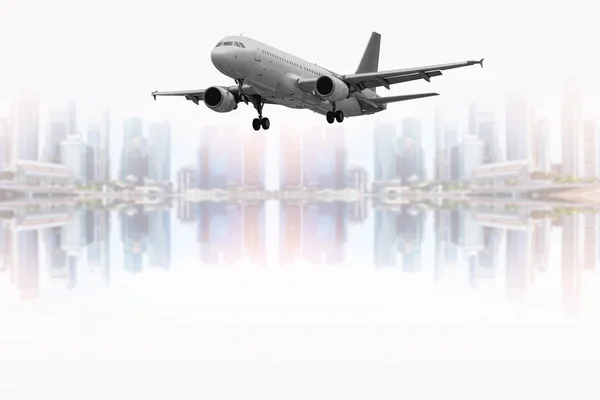 Civil aircraft and the city — Stock Photo, Image