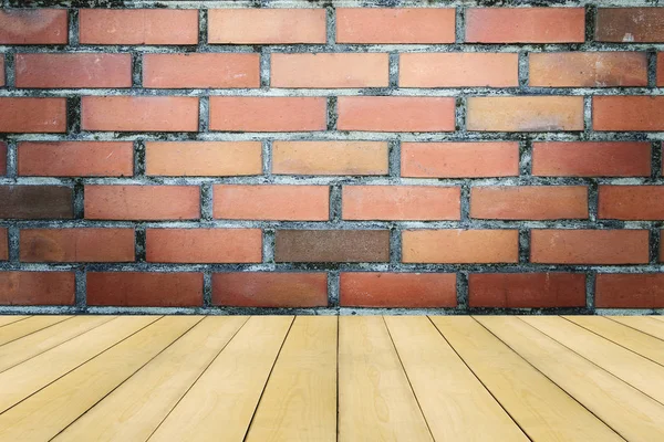 Wooden floor with colorful vintage brick wall — Stock Photo, Image
