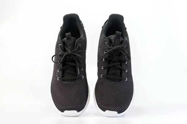 Zwarte sneakers loopschoenen — Stockfoto