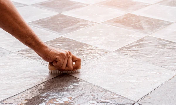 Cleaning the tile floor. — Stock Photo, Image