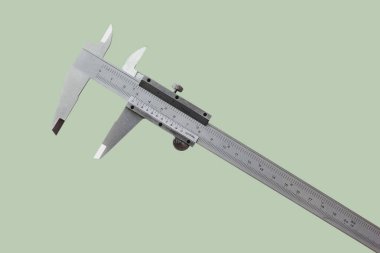 Vernier işlerin bir ölçüsüdür ve endüstri, pastel renk arka planında santimetre ve inç olarak ölçülür..
