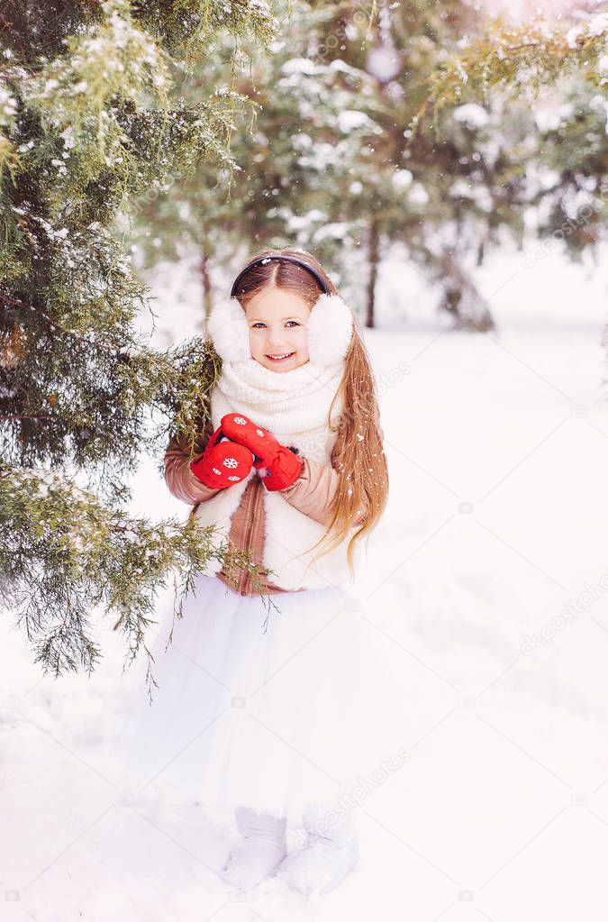 portrait of a cute girl in the forest, winter, cold