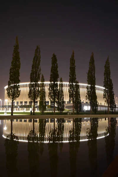 Krasnodar football stadium at night and its reflection in the water