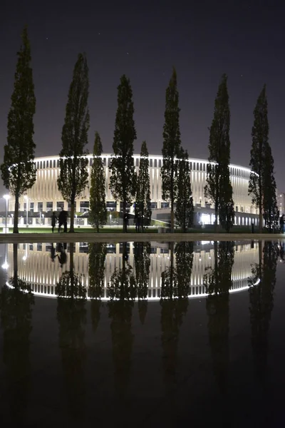 Krasnodar football stadium at night and its reflection in the water