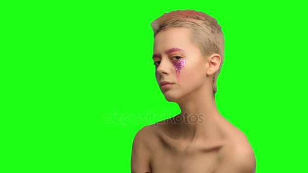 A girl with short hair and pink make-up art — Stock Video