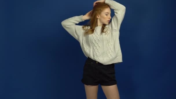 Portrait of student girl on blue background — Stock Video