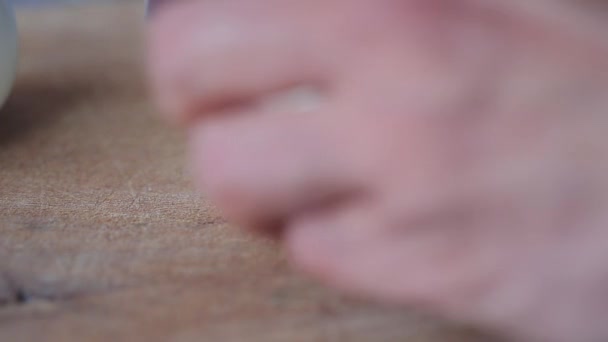 Man Cutting Boiled Egg on Chopping Board With Knife Close Up. — Stock Video