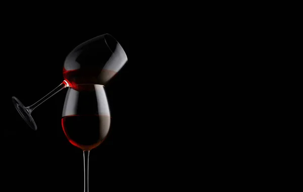 Two red wine glasses on a black background with copy space — 스톡 사진