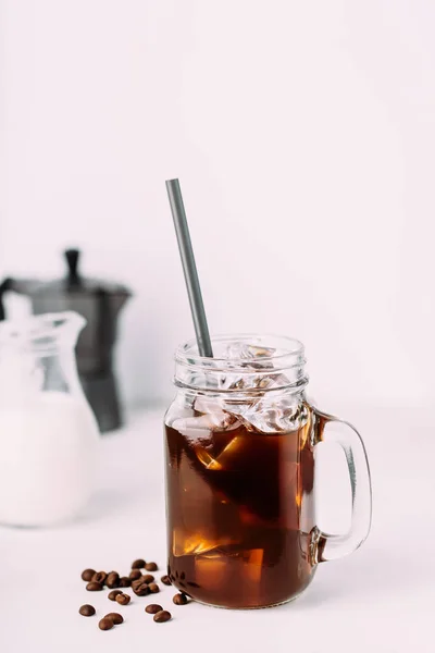 Iced coffee drink on glass jar with straw. — Stock Photo, Image